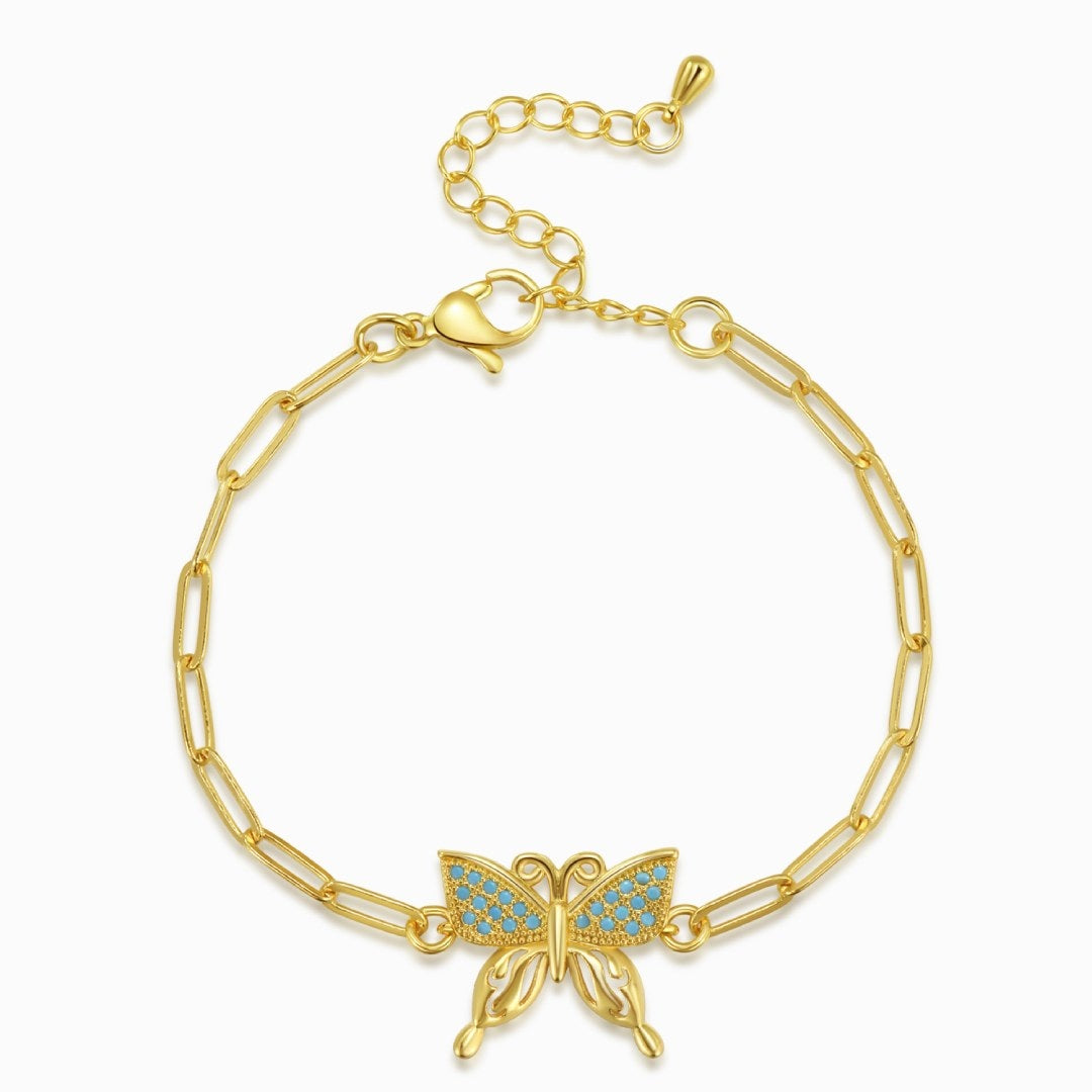 Butterfly charm gold plated bracelet in a white background